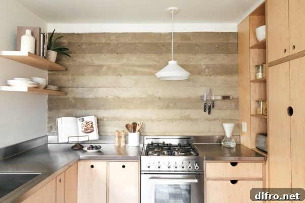 Basement kitchen with exposed board-formed concrete wall