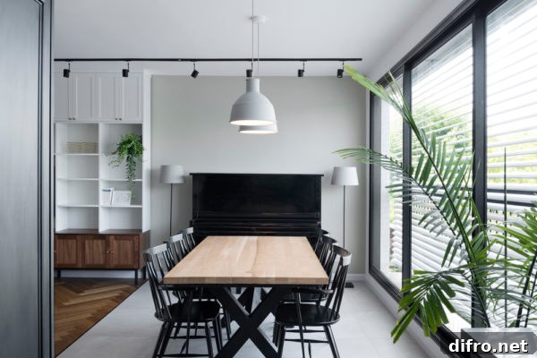 Dining room with black, white, and wood tones in a modern apartment