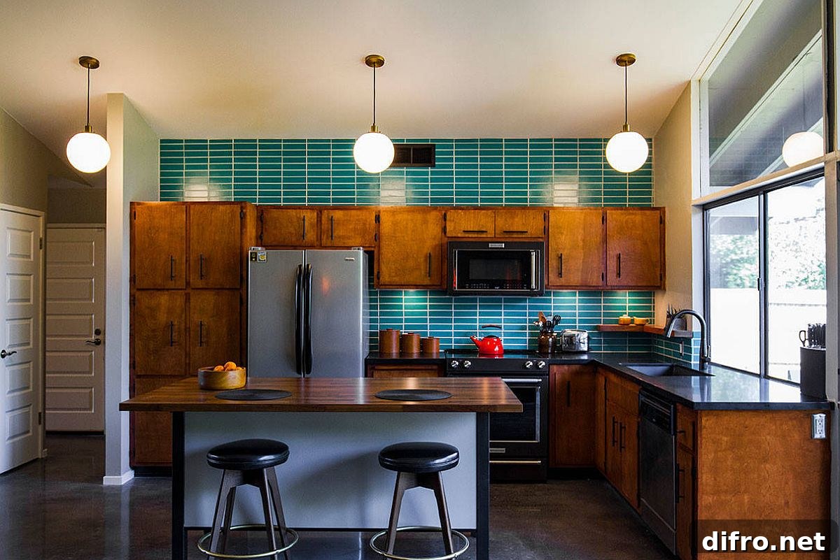 Mid-century kitchen with wooden cabinets, green tile backsplash and black appliances
