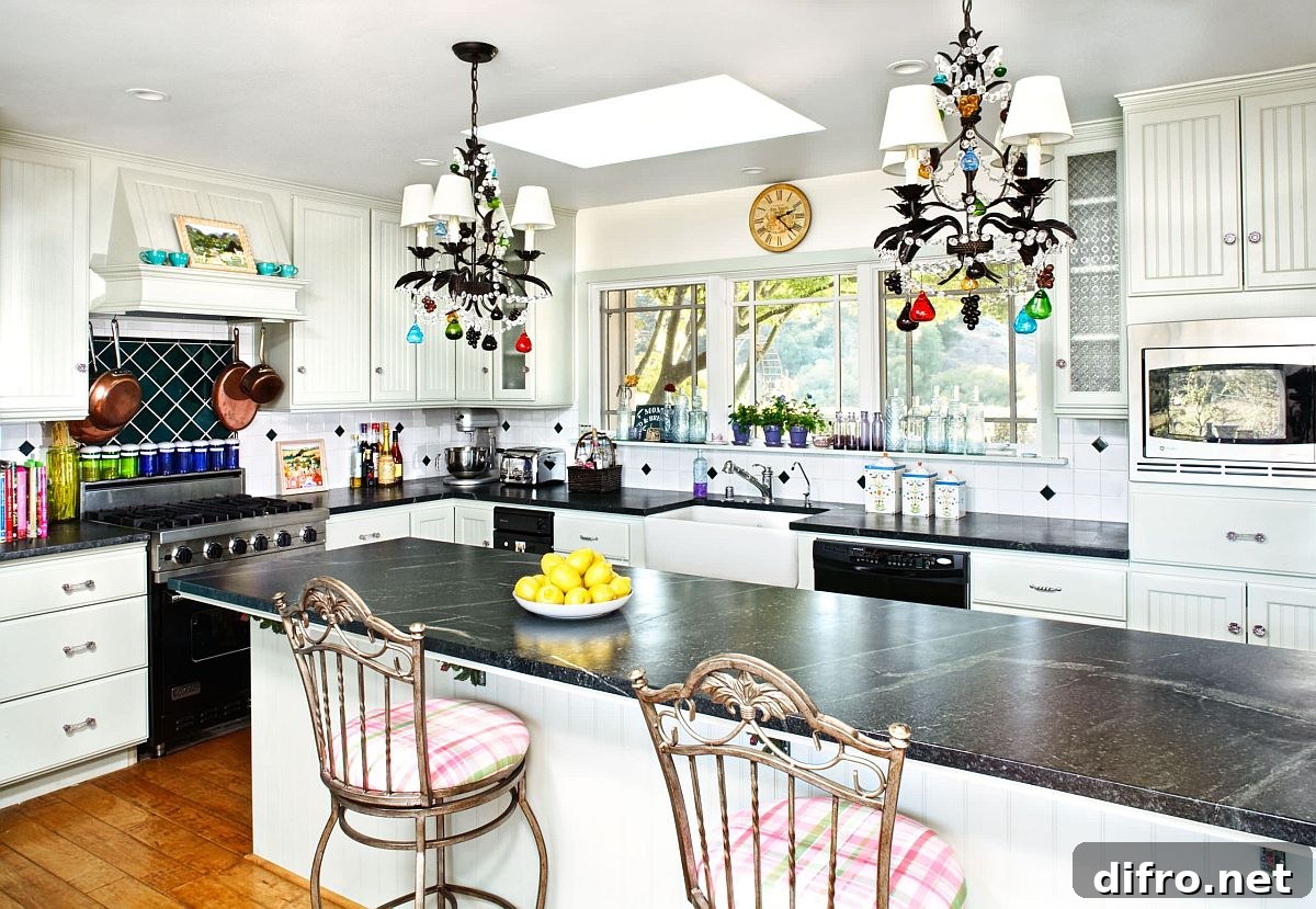 White Santa Monica kitchen featuring black appliances