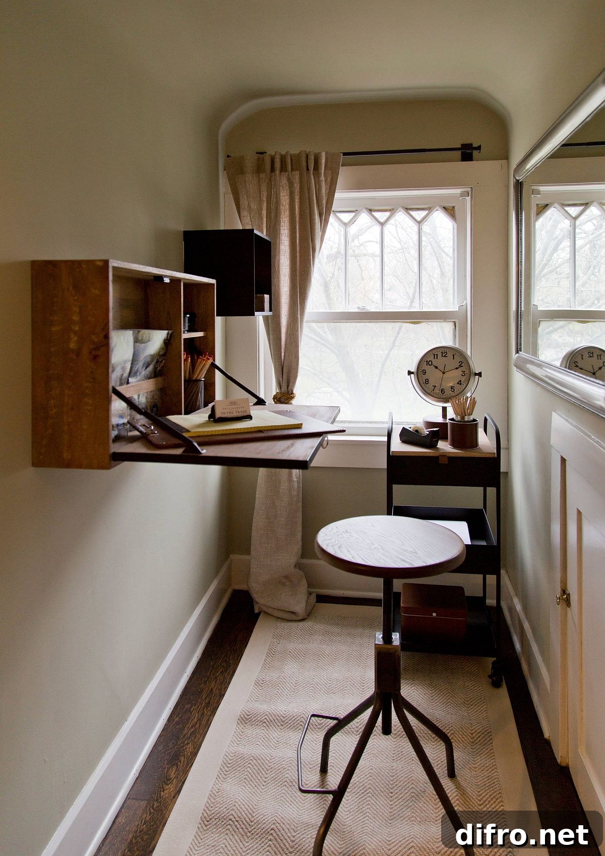 Bright small workspace with folding wooden desk
