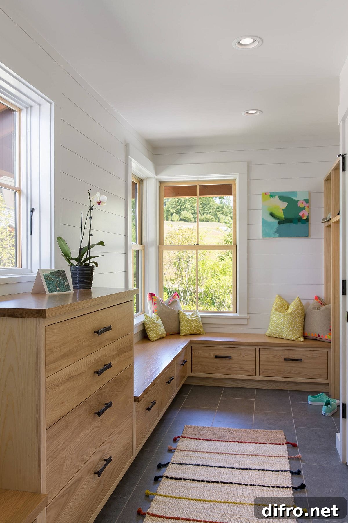 Wood-and-white entry with gray porcelain floor and built-in storage