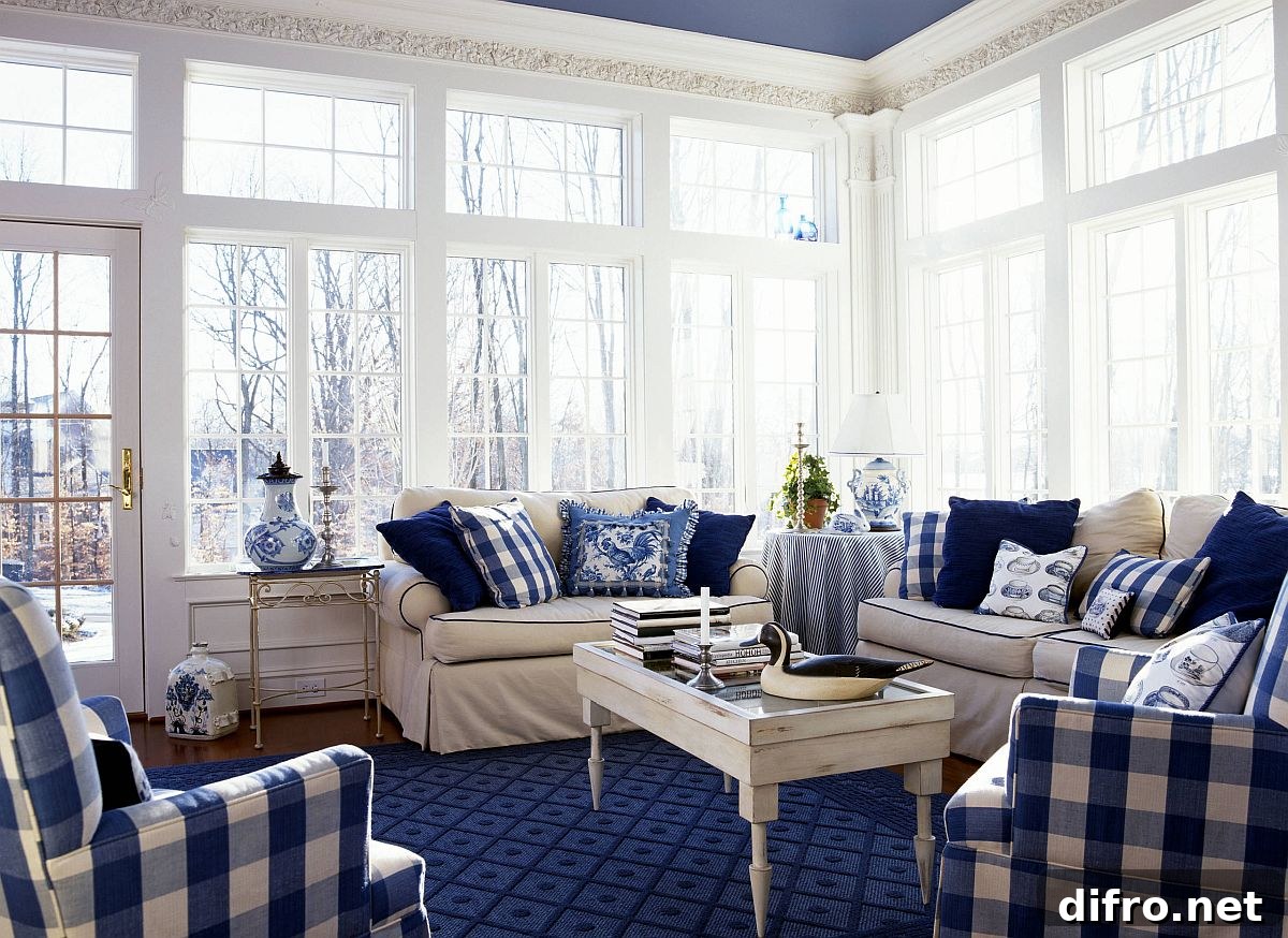 Blue checkered sofa covers and pillows in white sunroom