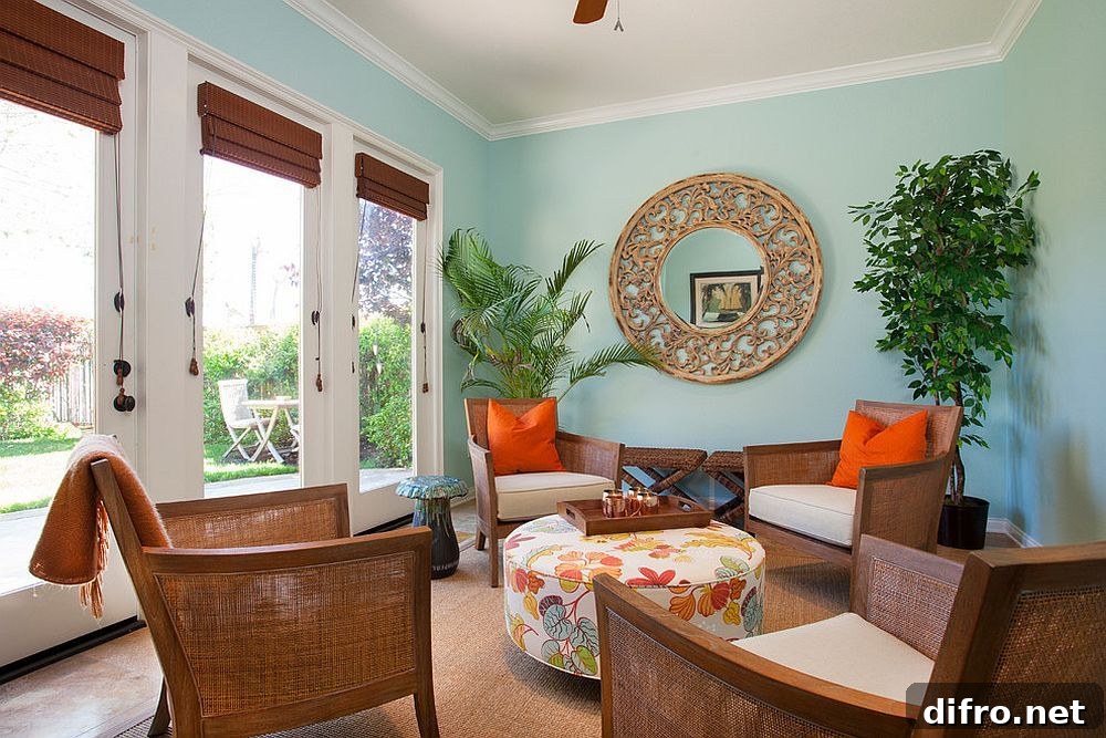 Sunroom in blue with indoor plant and accent pillows