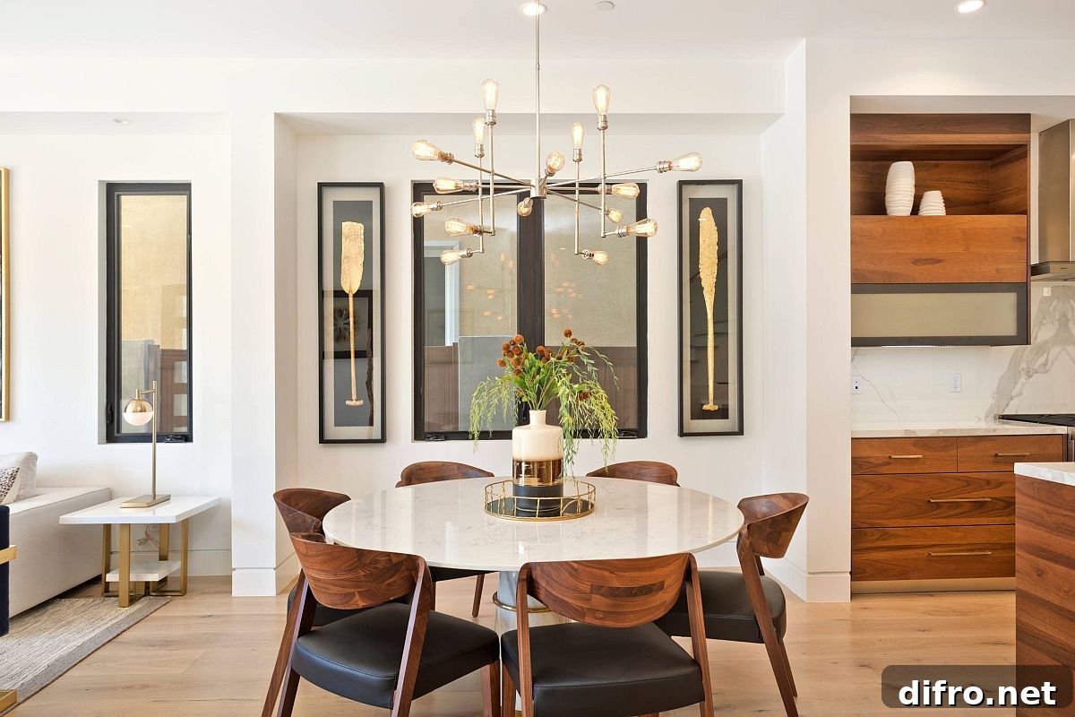 Sculptural chairs beside a marble dining table