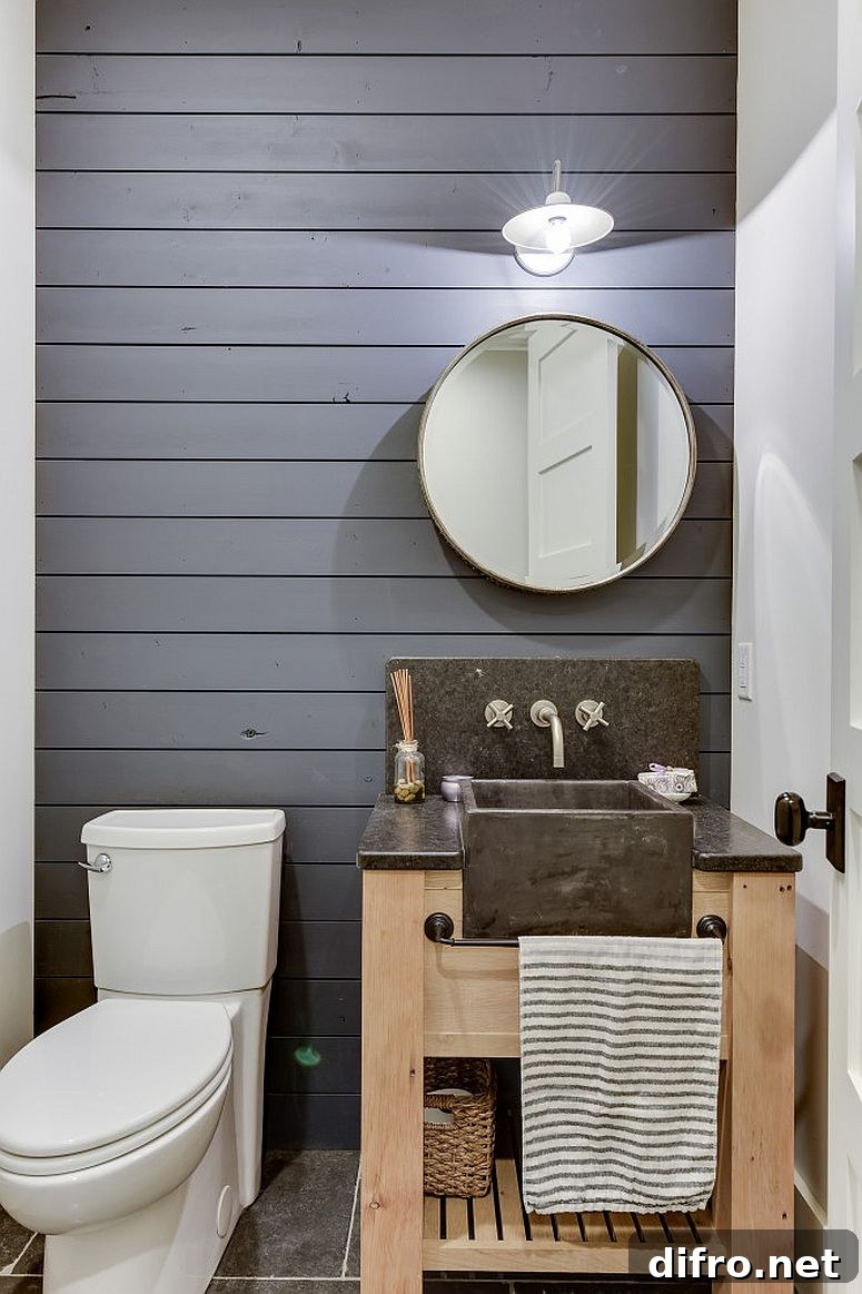Reclaimed white oak vanity with gray accent wall in a tiny powder room
