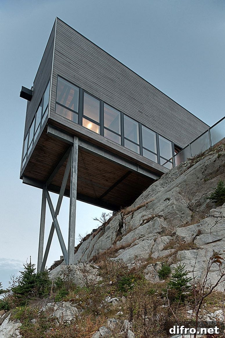 View of the house from below on the rocky coastline