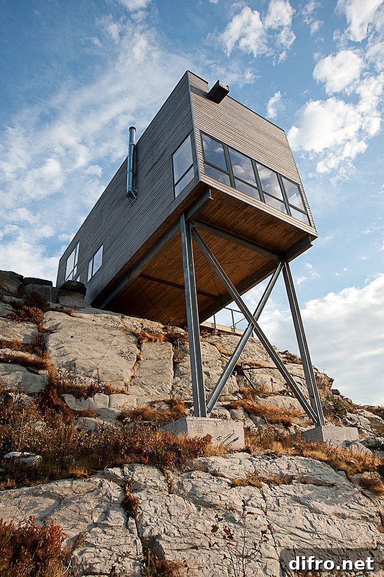 Rustic cabin cantilevered above the rocks
