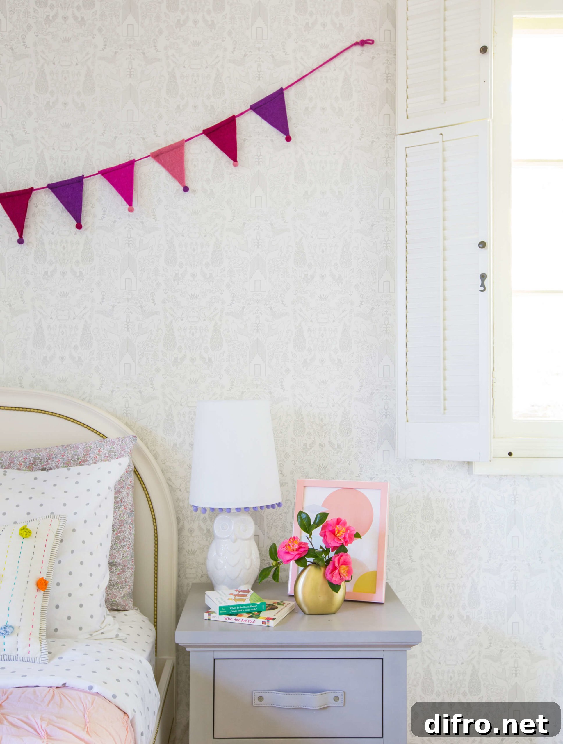 Subtle patterned wallpaper in girls' bedroom