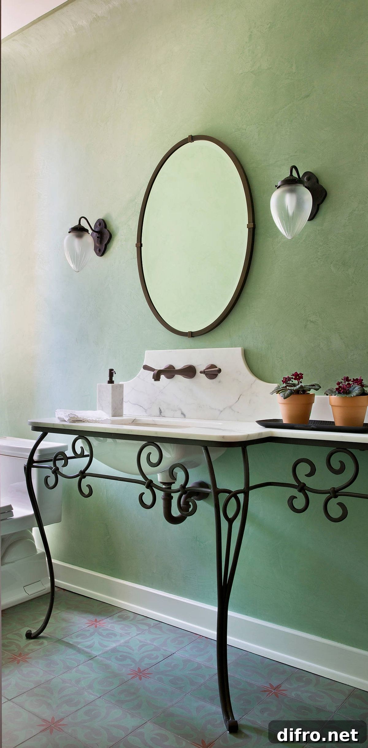 Mediterranean-style powder room with green walls