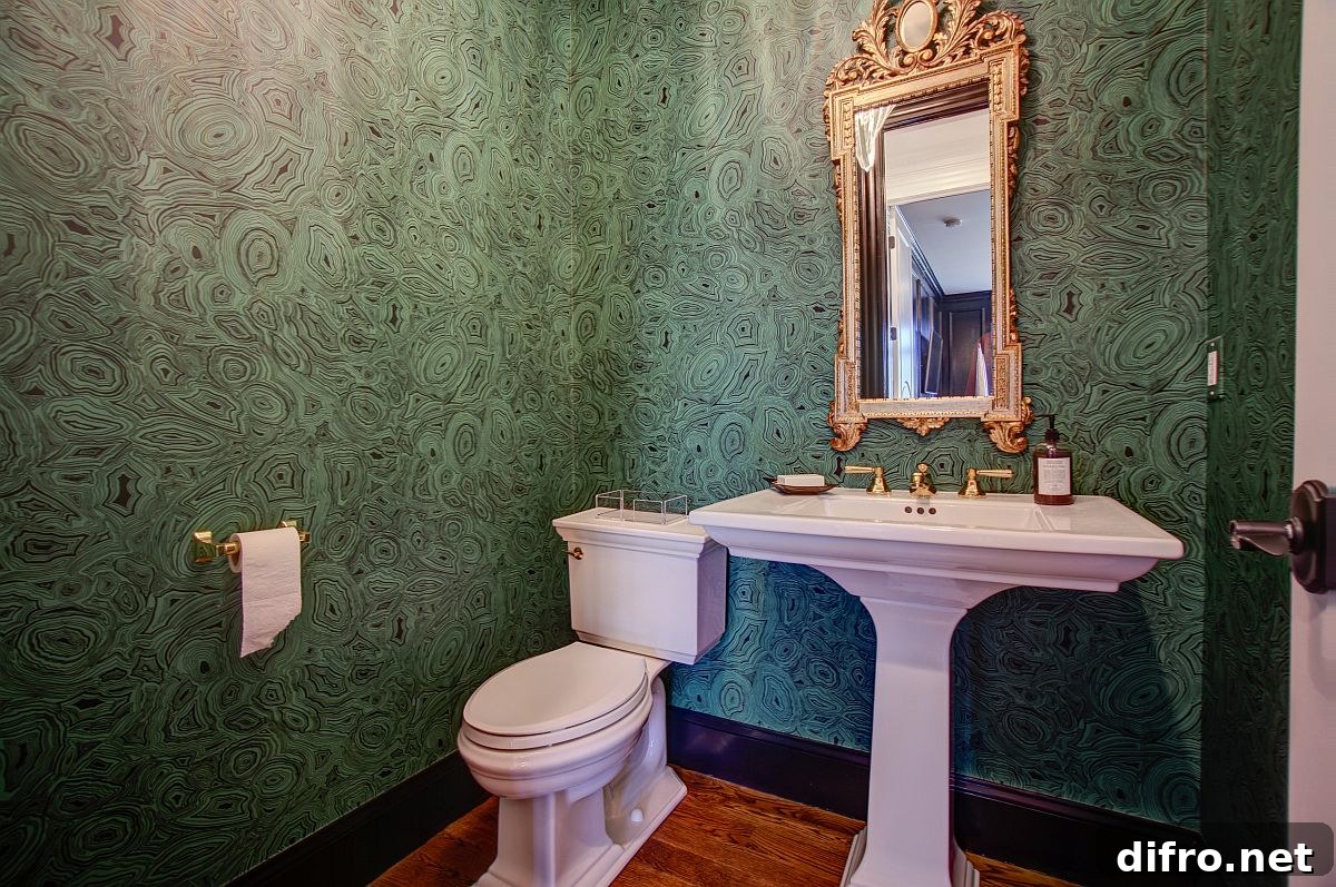 Malachite green wallpaper in a powder room