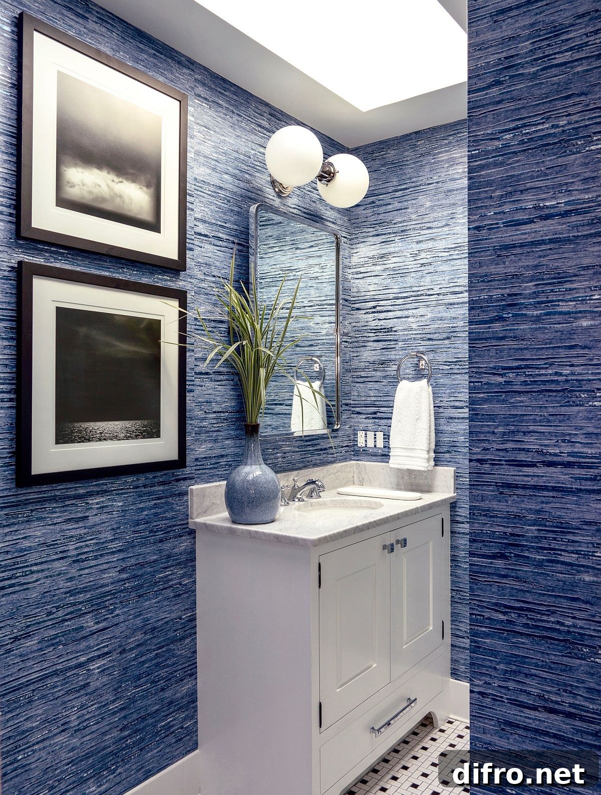 Textured blue powder room with skylight
