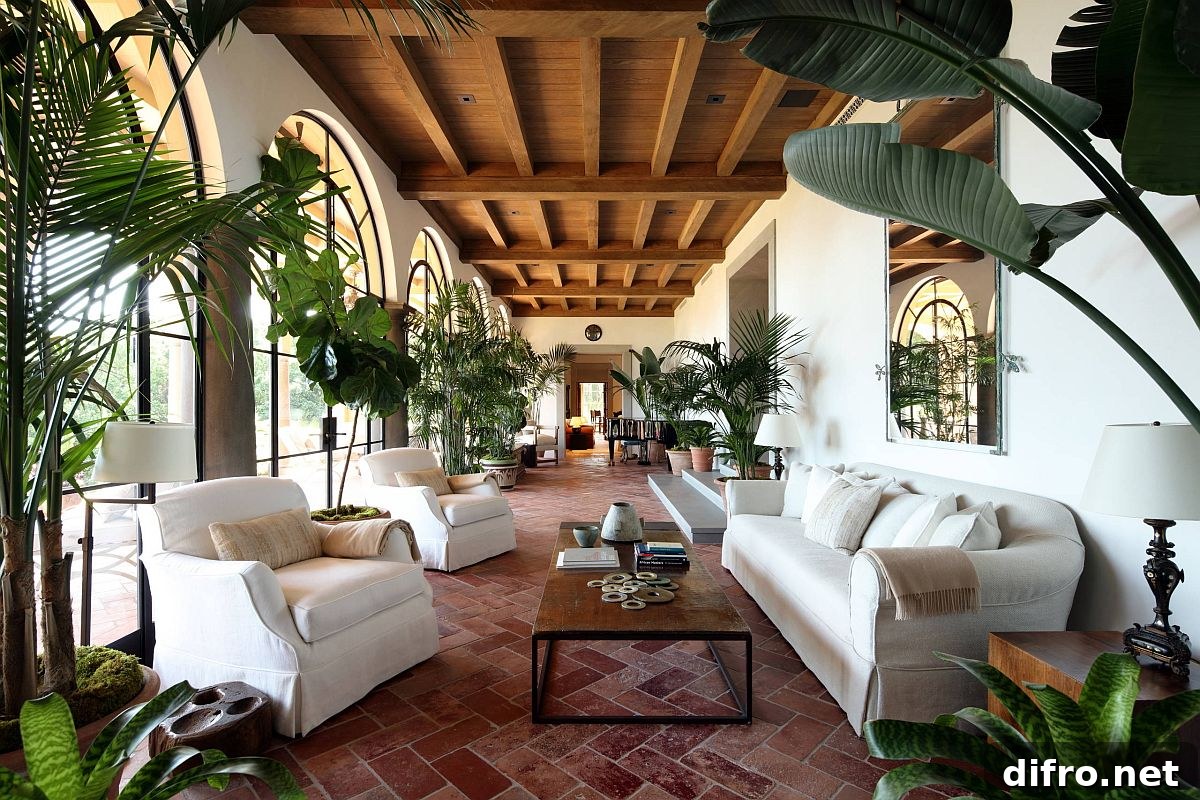 Sunroom and living room with terra-cotta floor and ample greenery
