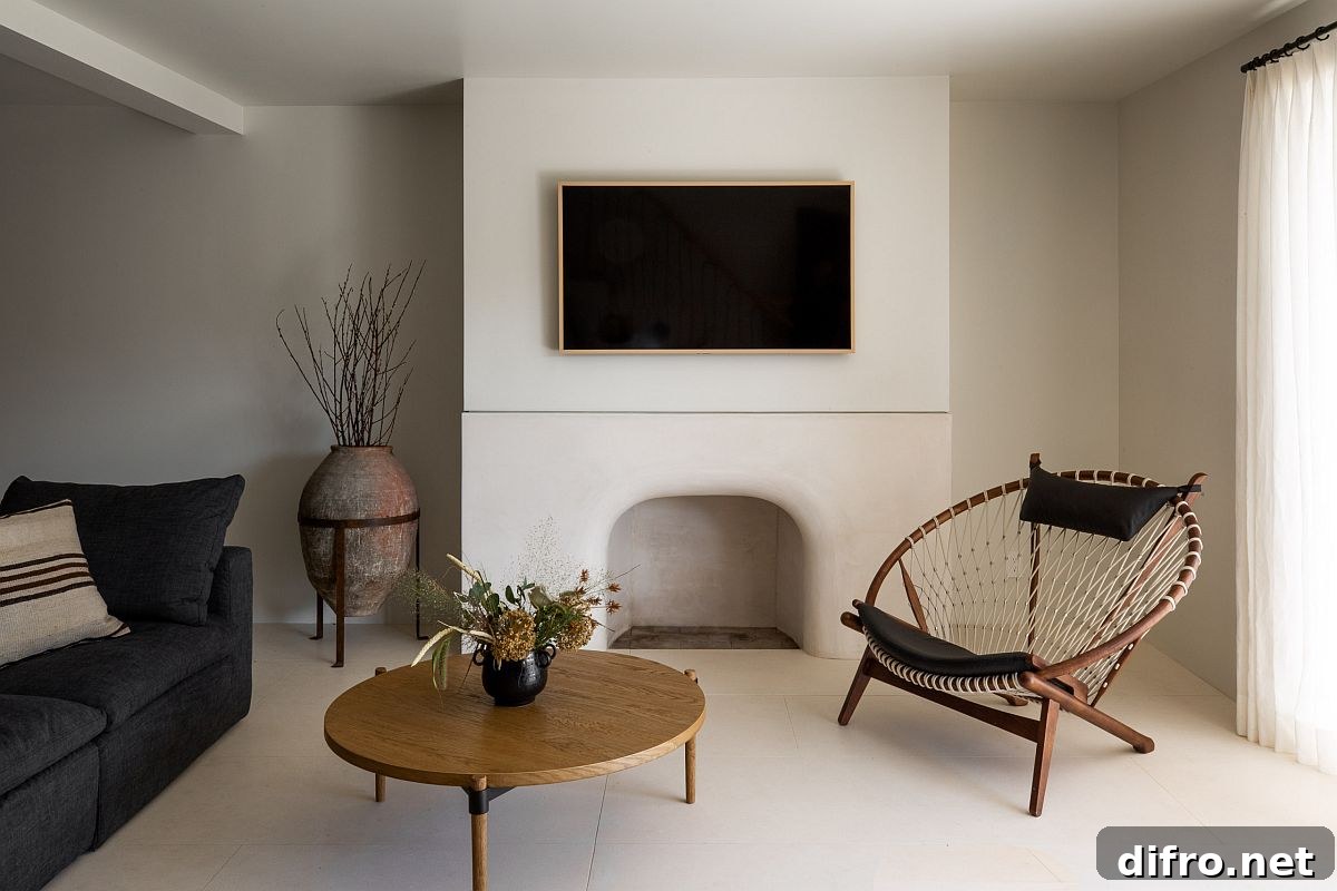 Large terracotta pot used as a floor vase in a modern Mediterranean-style living room