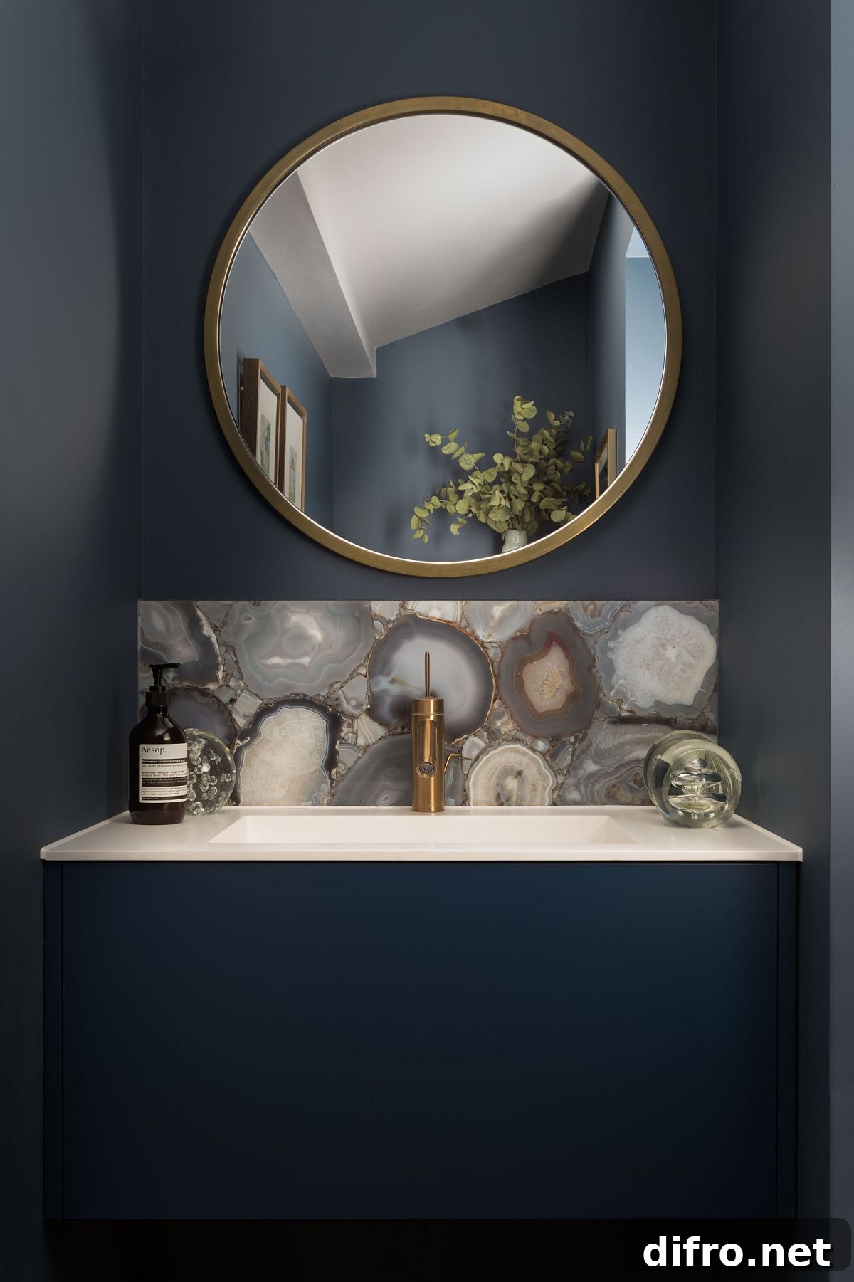 Tiny bathroom with dark blue vanity