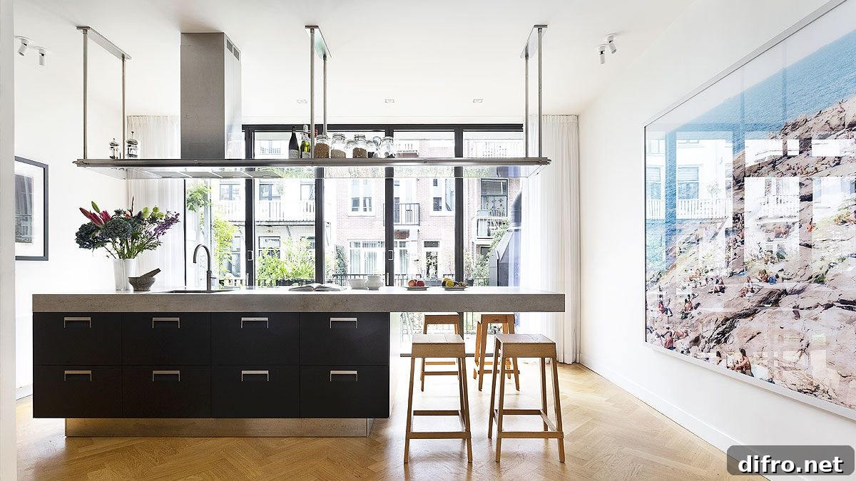 Custom kitchen island with dark cabinets and a breakfast bar that feels dramatic
