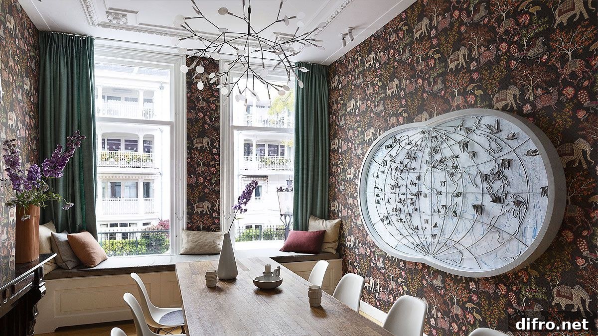 Dramatic dining area with wallpapered backdrop and lovely views