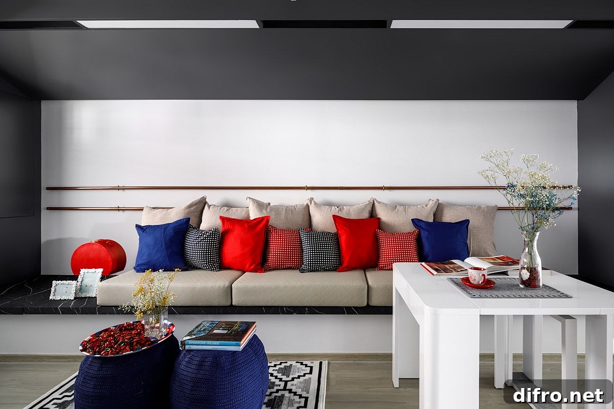 Minimal gray and white living area with accent pillows in multiple colors