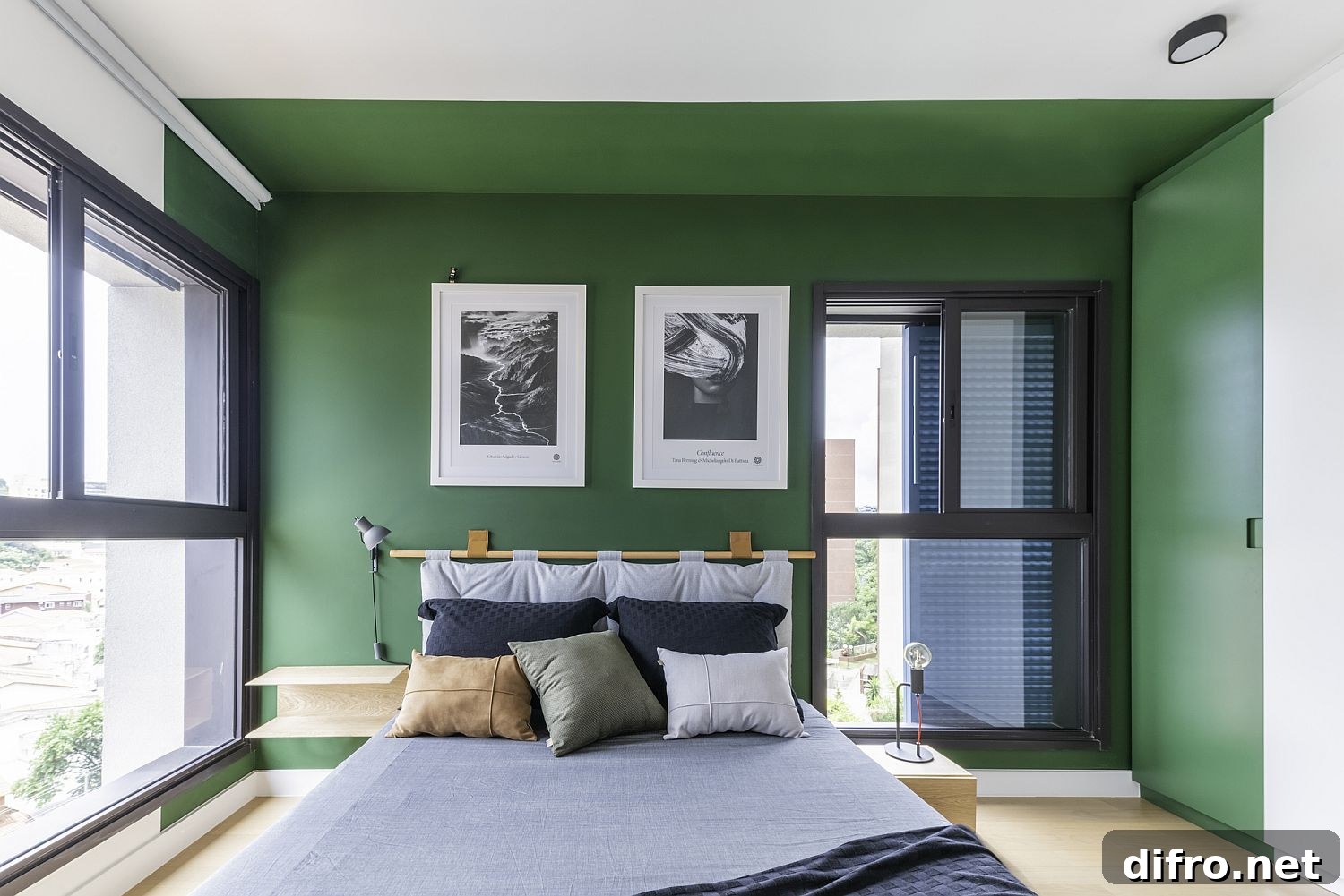 Bedroom with green accent wall in Flora Apartment