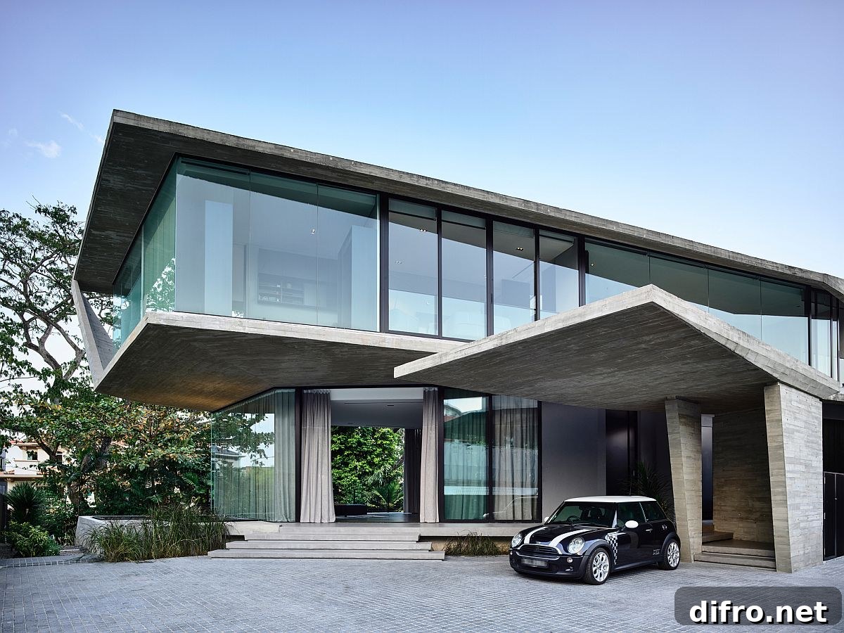 Glass walls combined with concrete slabs to create an expansive modern home in Singapore