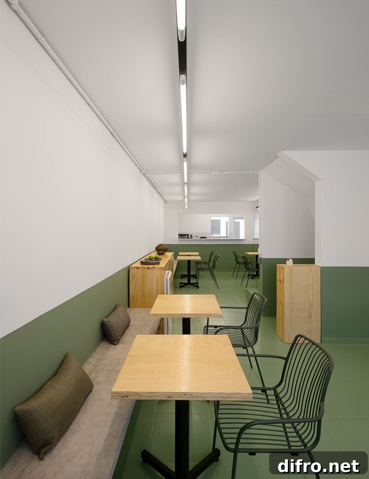 Interior view showing green-painted lower walls and white upper walls in the restaurant