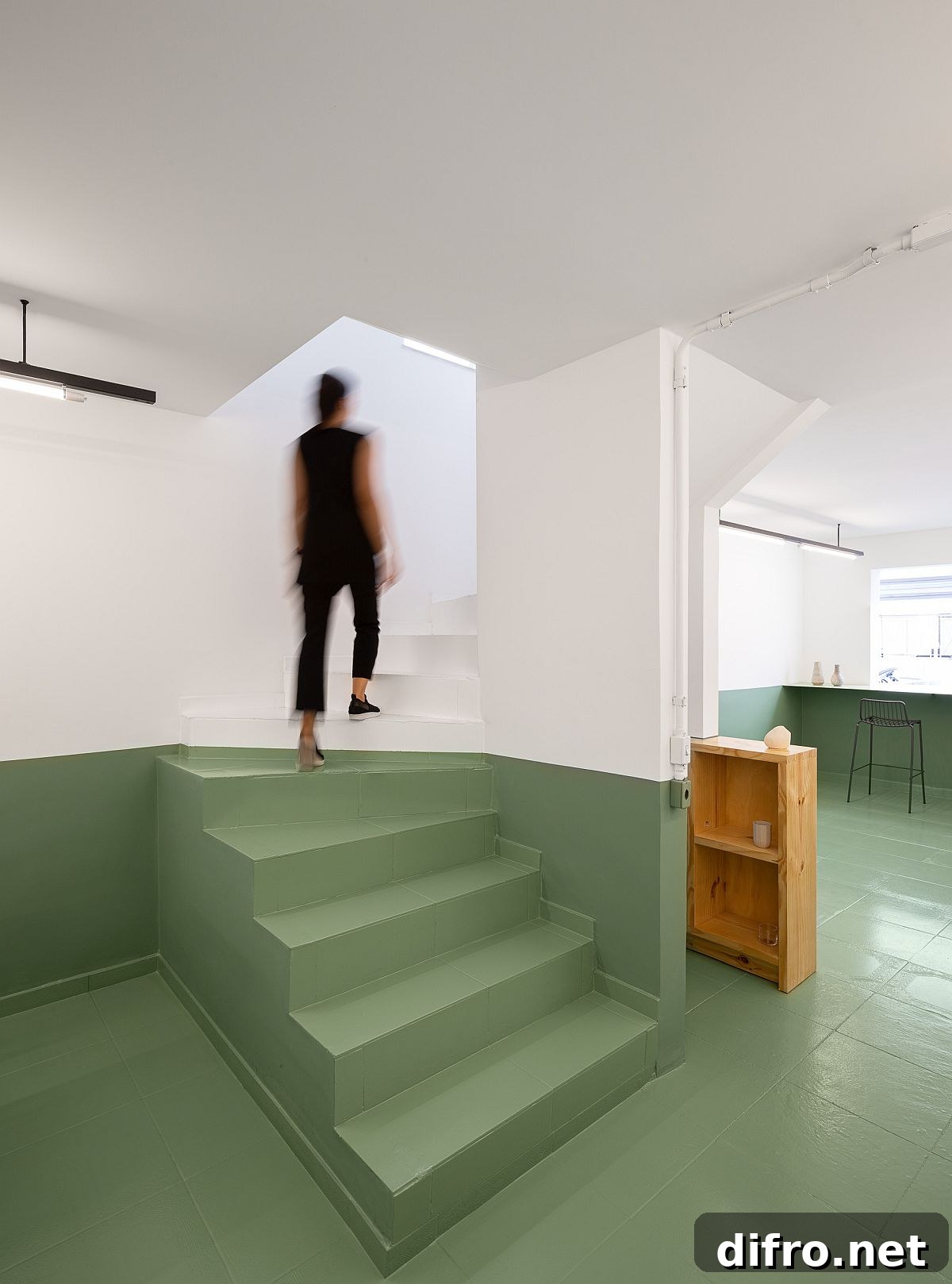 Detail of green-painted lower walls contrasted with white upper walls