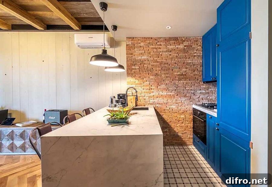 Kitchen with blue cabinets at the end of the living area