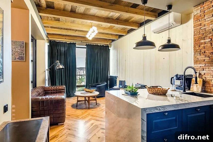 Small industrial living room with plush leather sofa and brick walls