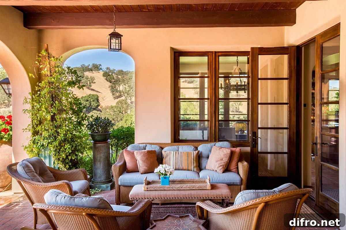 Mediterranean porch with pastel orange walls and wooden beams