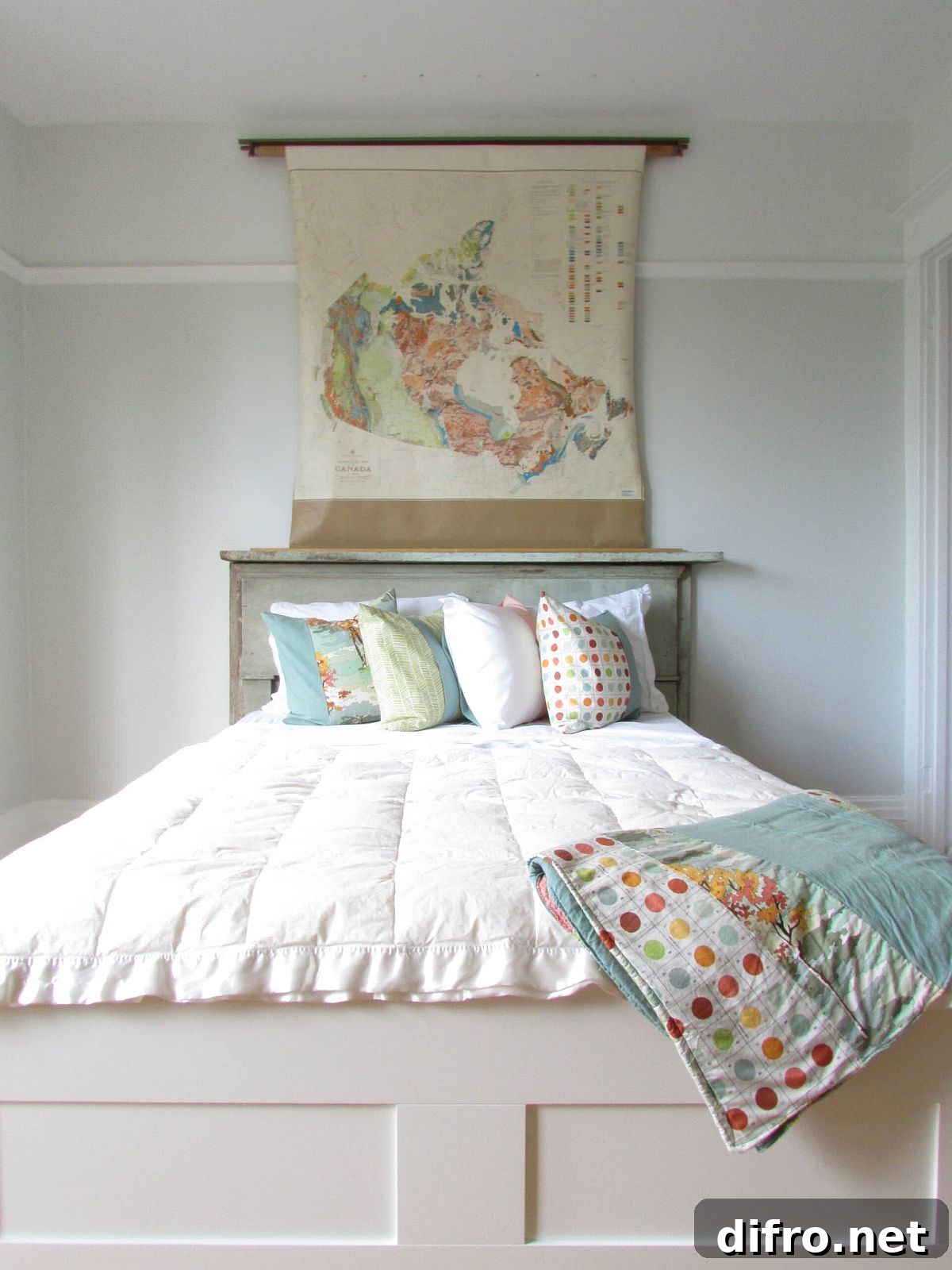 Shabby chic bedroom with map above headboard