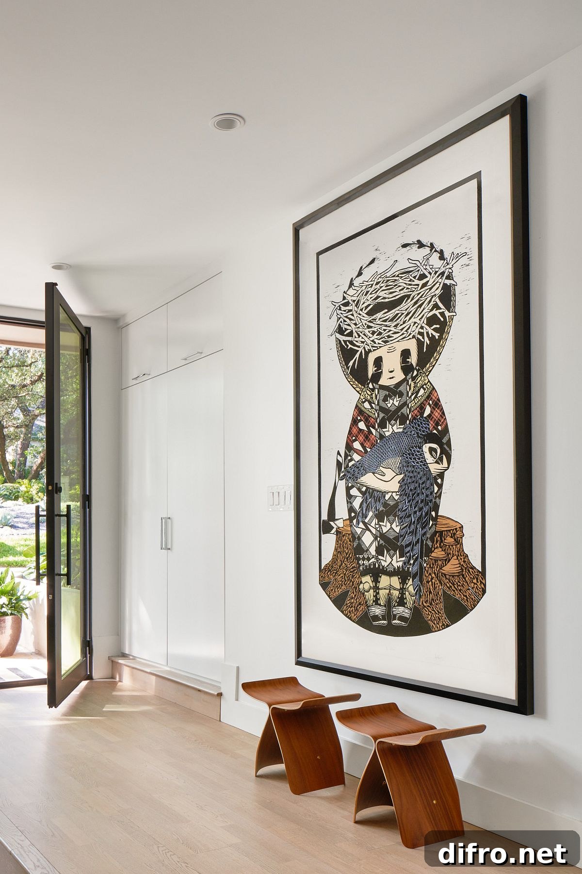 Wall art in spacious white modern entry