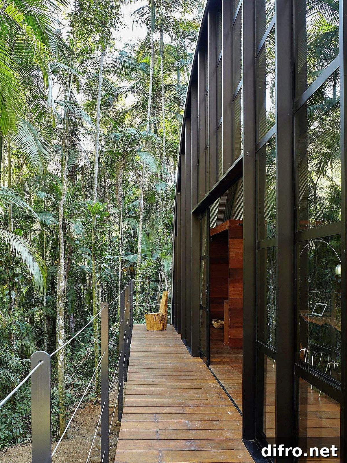 Long balcony of the house offers delightful views of the rainforest around the house