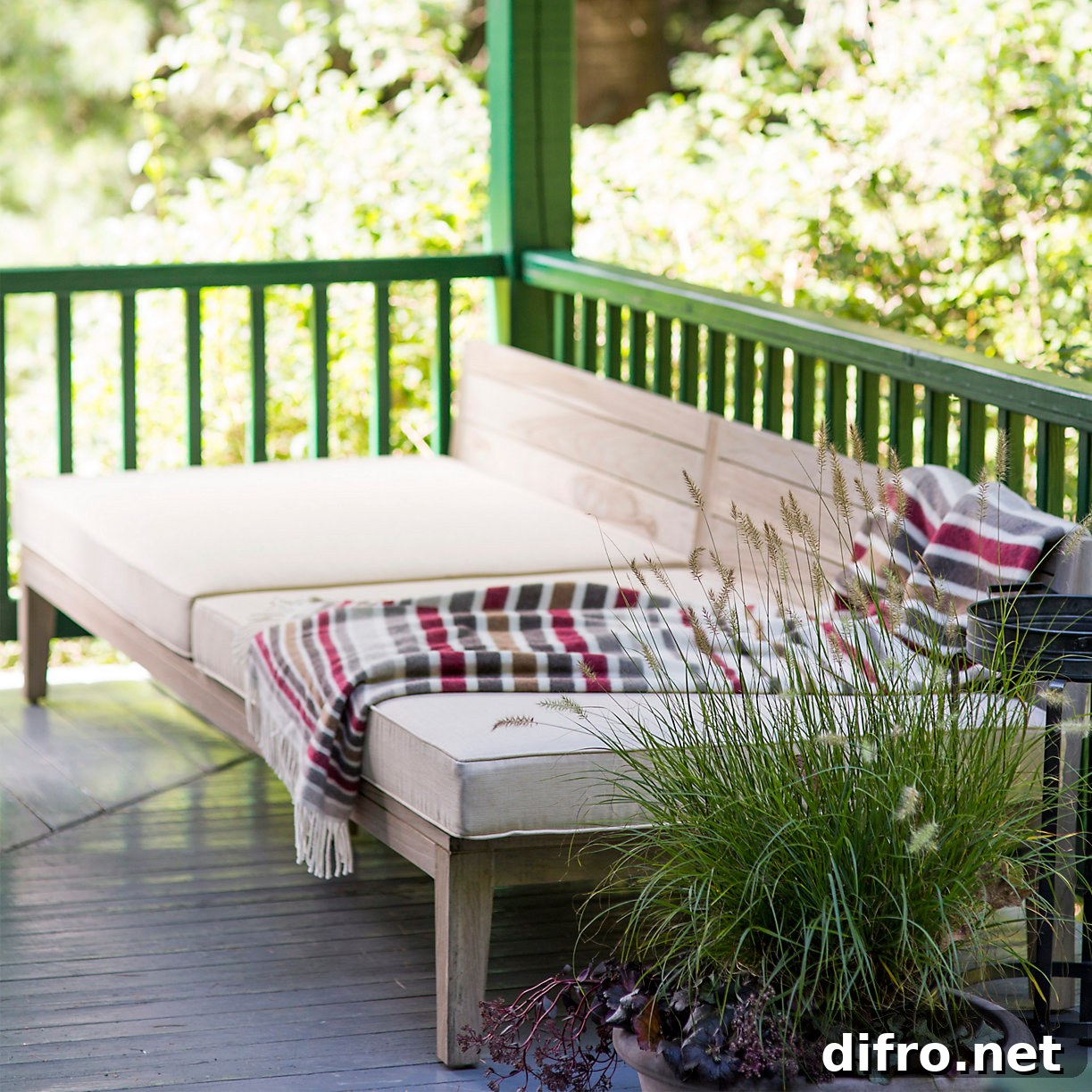 Cozy outdoor space with blanket draped over seating