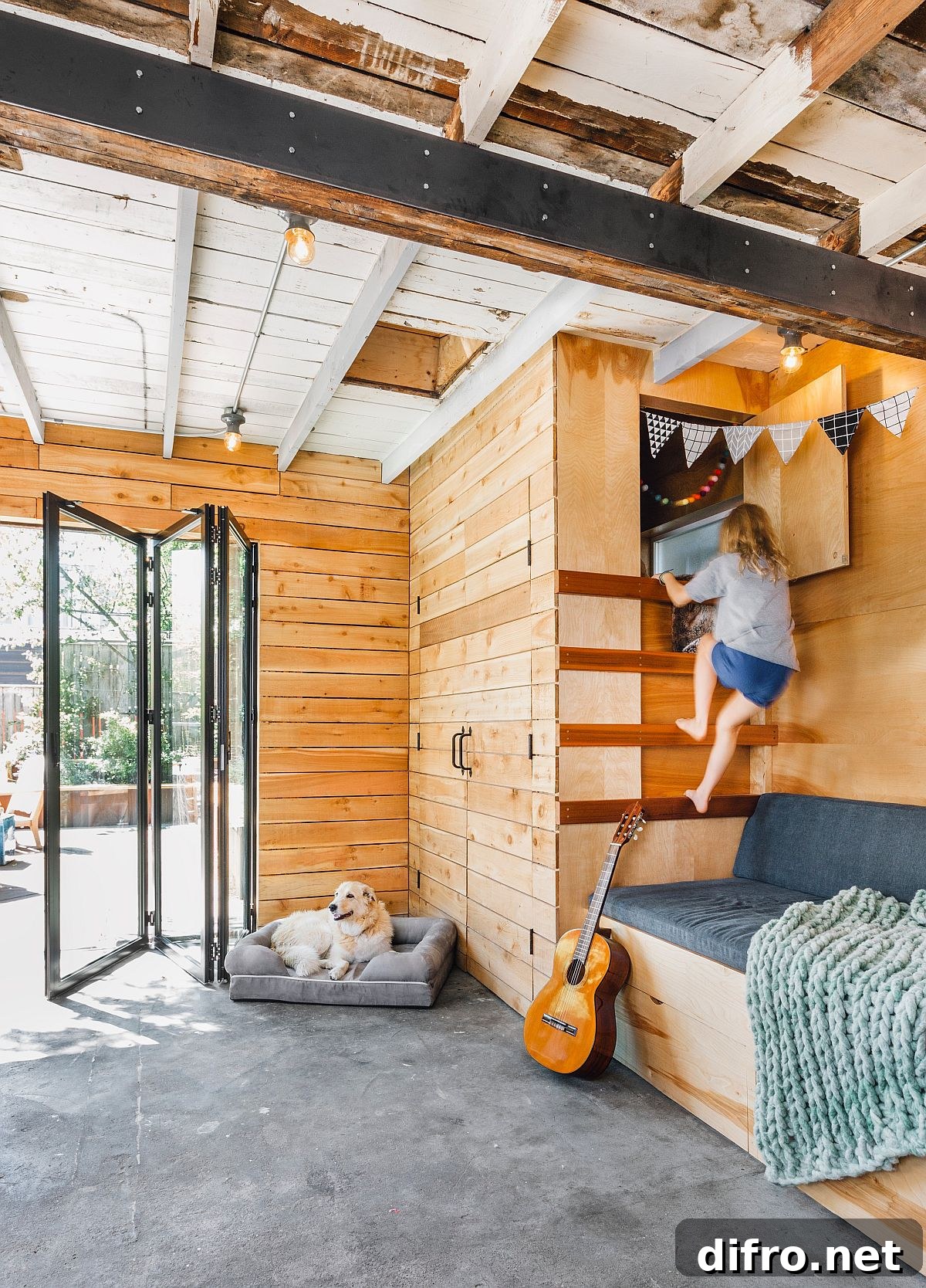 Farmhouse style kids' room with bunk beds and concrete floor