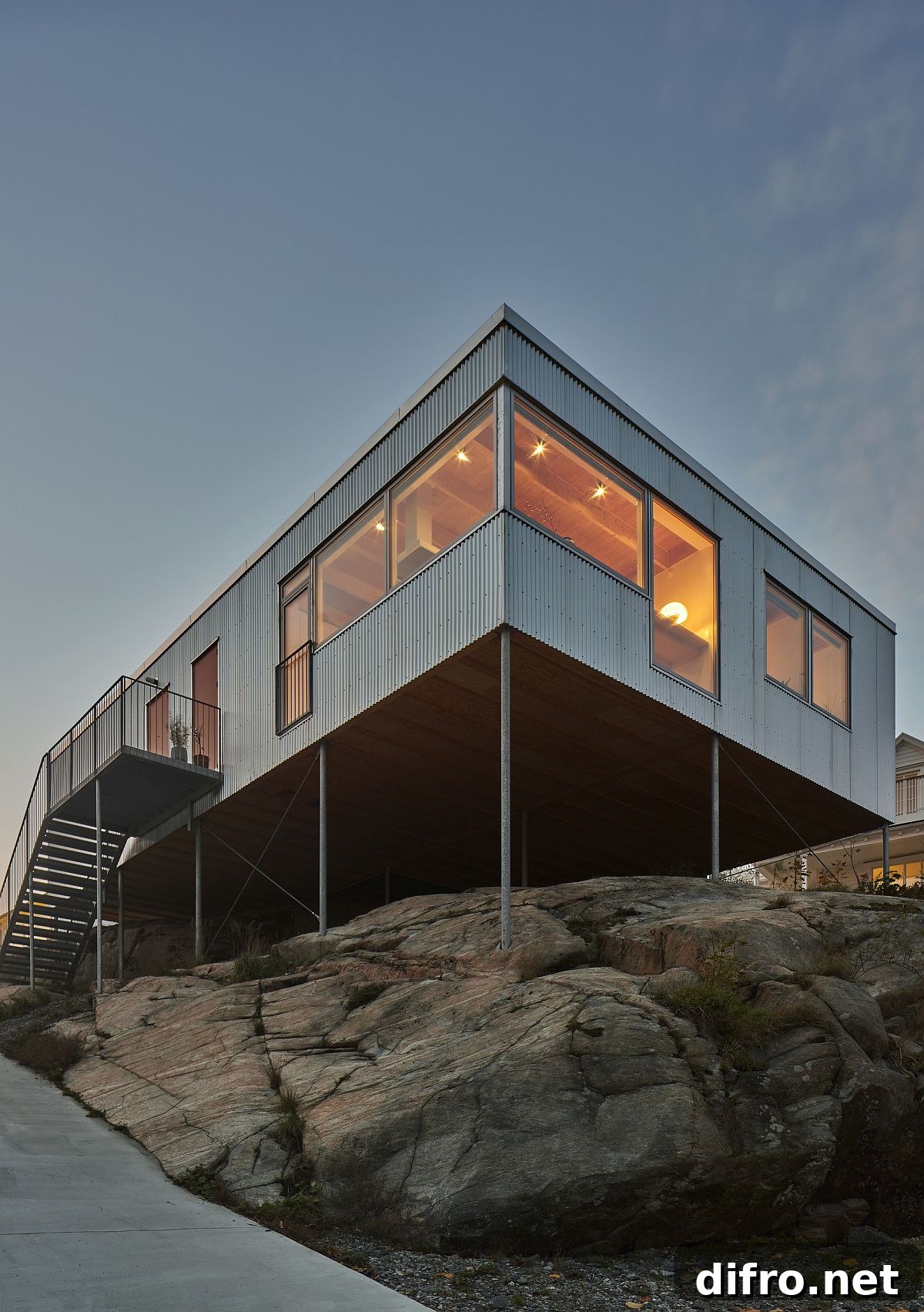 Slim steel pillars anchored into granite