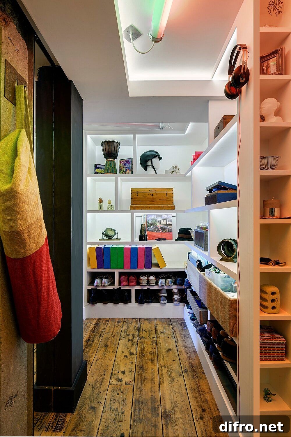 Beautifully lit closet also is used as a lovely decorative element inside the apartment