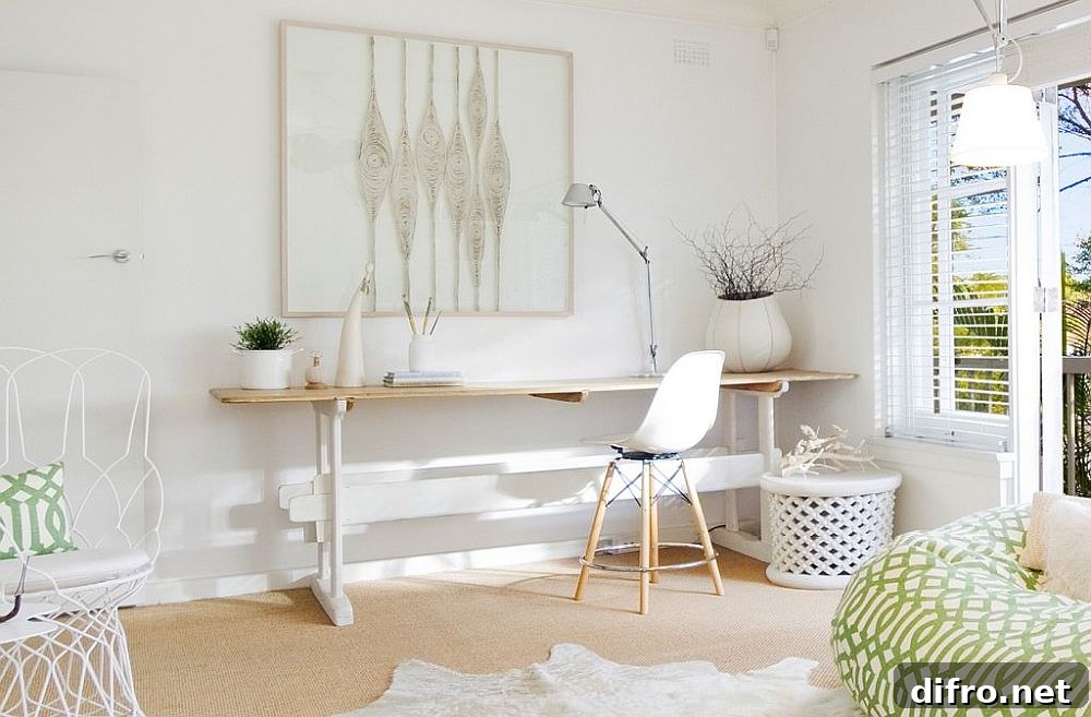 Simple sleek desk and comfortable white chair for a home workspace