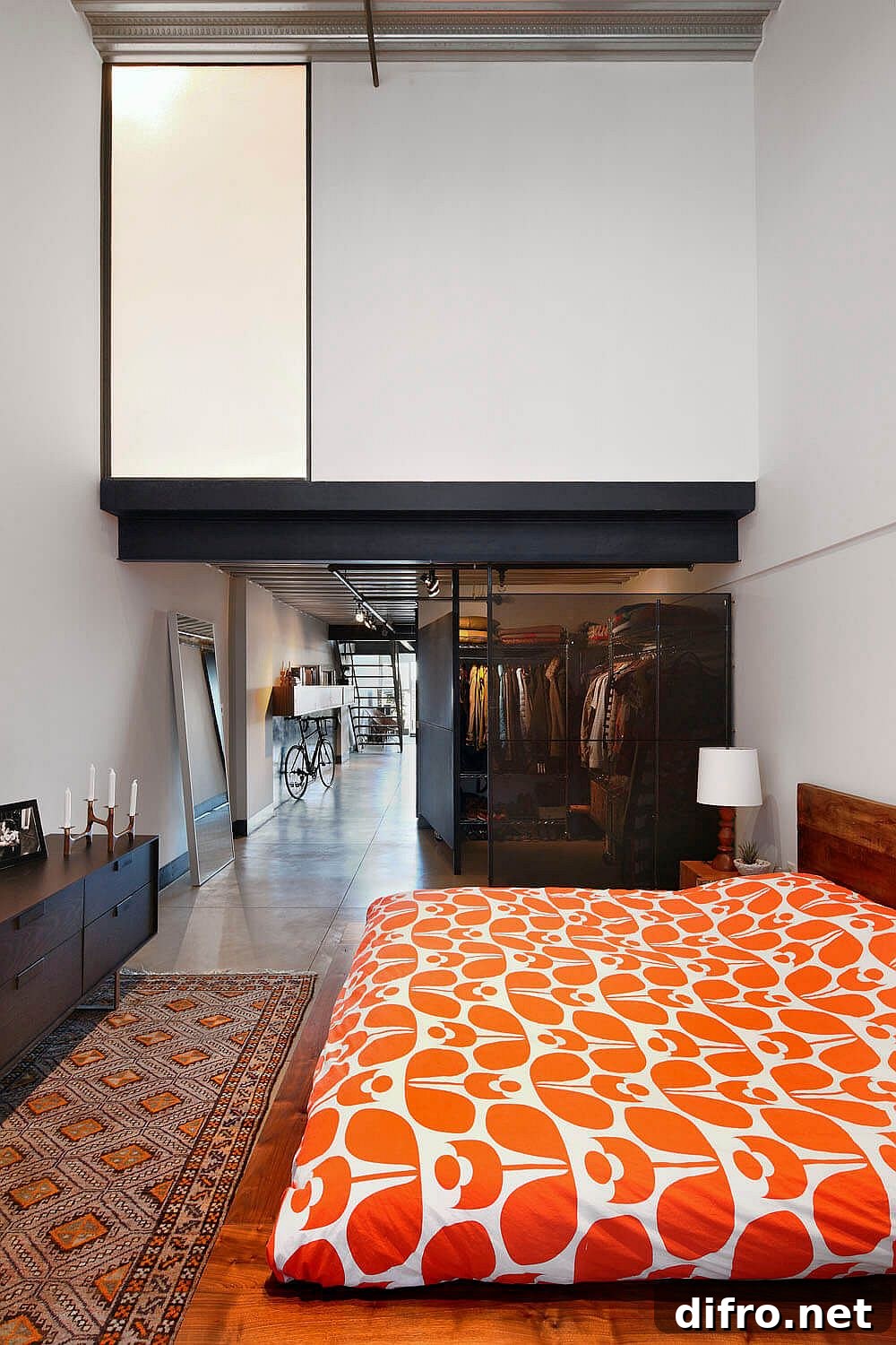 View of the master bedroom after renovation with a custom wardrobe in perforated steel