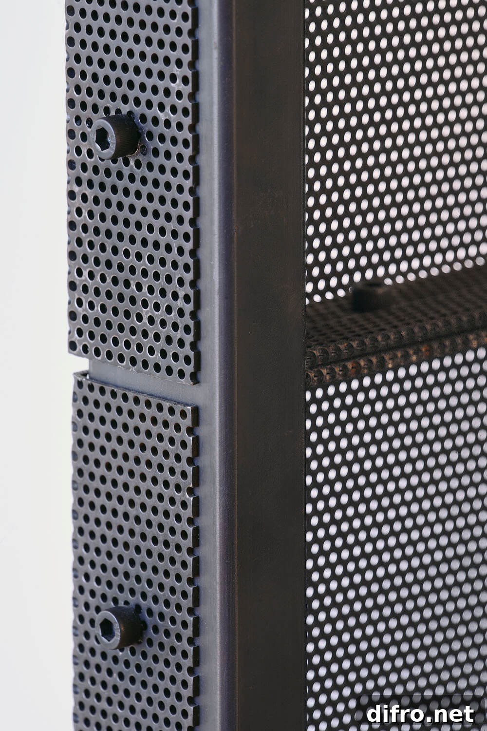 Custom-crafted lightweight enclosure of perforated steel is used to create the closet in the master bedroom