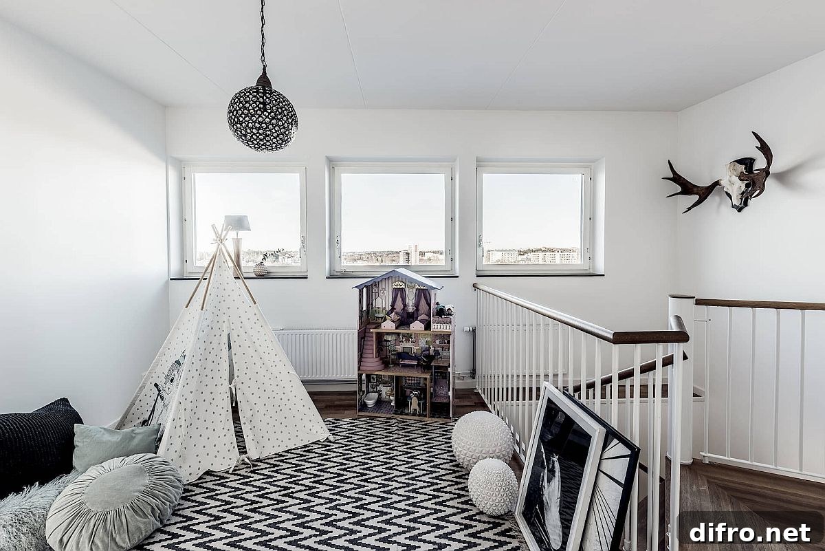 Scandinavian black and white playroom in staircase landing