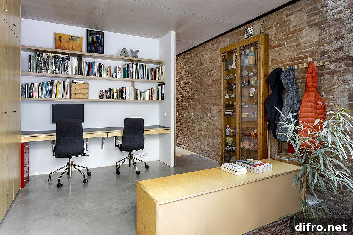 Modern home office with exposed brick walls at Casa EP15340