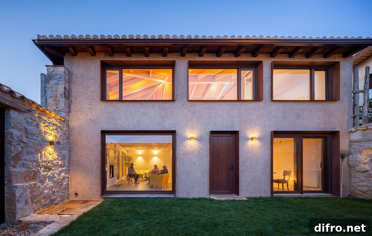 Large glass windows and sliding doors in classic exterior
