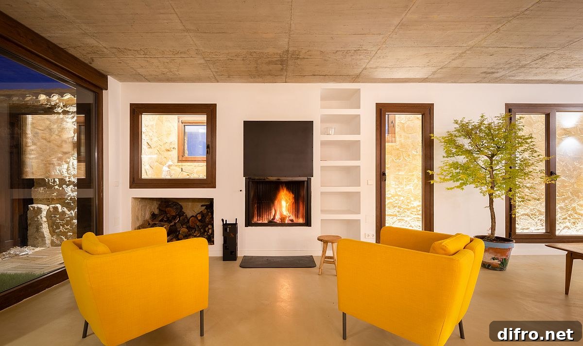 Contemporary living area with yellow chairs and fireplace