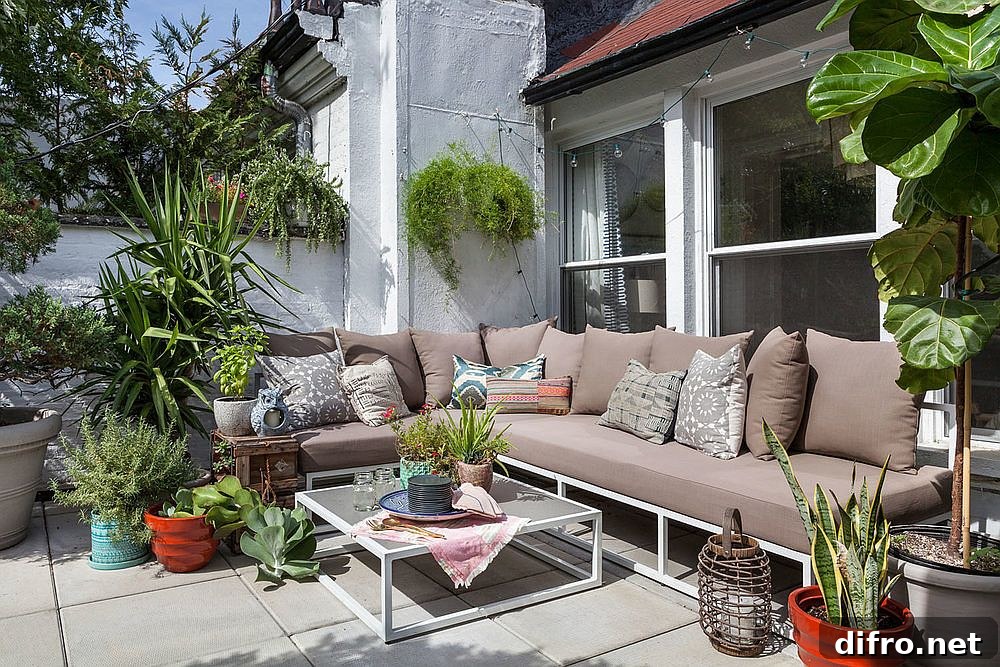 Small patio with outdoor sectional and greenery