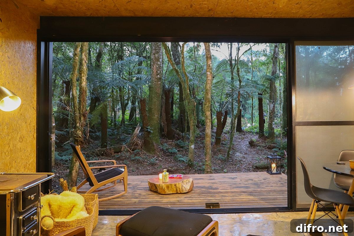 Translucent sliding glass panels connect the interior with the deck and view outside