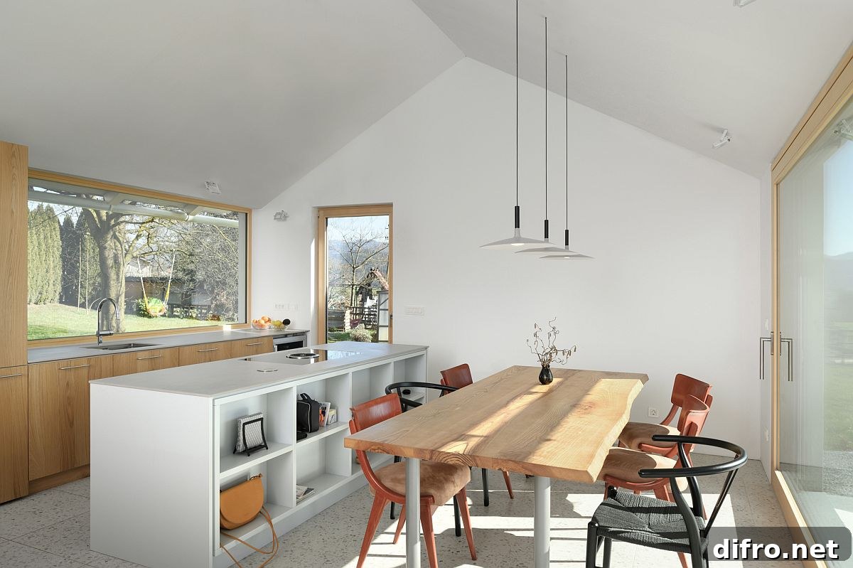 Wood and white kitchen and dining area