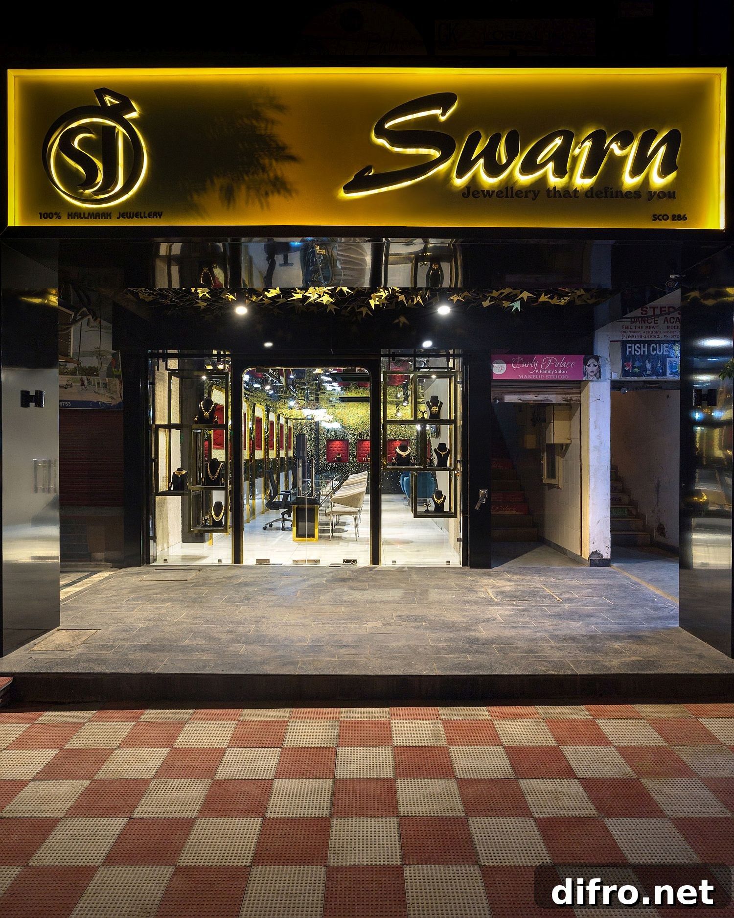 Street facade of Swarn Jewellers draped in black and gold