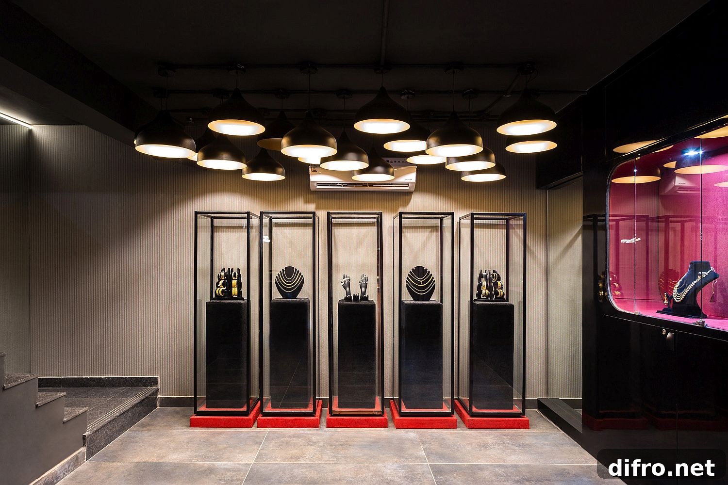 Dramatic accent lighting highlights jewelry inside the store