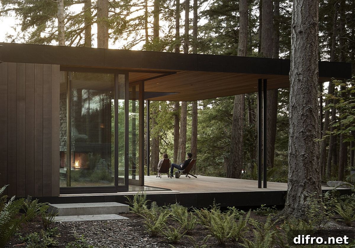 Covered deck surrounded by cedar and fir trees