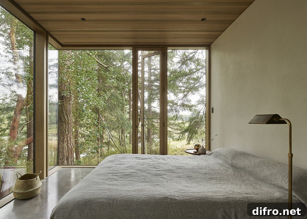 Folding glass doors connecting bedroom and outdoor greenery